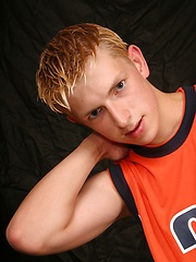 Blond twink strokes dick