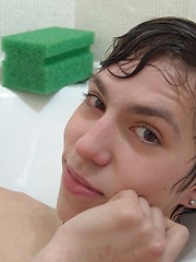 Cute teen boy Kish plays in the shower