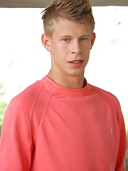 Sweet white-haired boy posing on the building