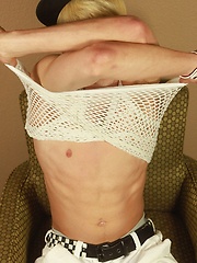Blond twink Angel Villanueva tugs on his thick cock.