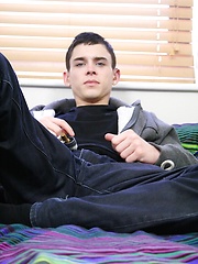 Sexy twink Aaron Aurora stroking his hard cock.