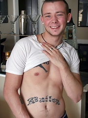 Tattooed Kyle Collins stroking his small cock.