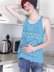 Skinny redhead twink Elijah Young jerks off in kitchen.